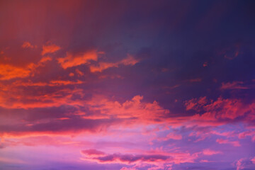 Fototapeta premium Beautiful sunset sky above clouds with dramatic light. Cabin view from airplane