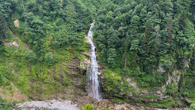 Gelin Tulu Waterfall Cascading Through Lush Green Forest in Ayder Plateau, Rize, Northern Turkey
