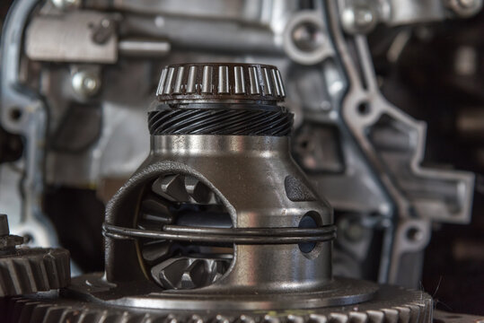 Close up of an automotive differential gear assembly bearings precision machined metal components for transmission repair maintenance mechanical engineering