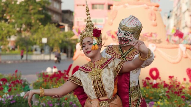 Performers in Traditional Costumes Performing Thai Khon Dance Outdoors