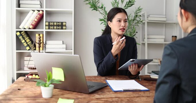 Legal professionals are engaging in a serious discussion, offering advice to a client in a modern office setting, symbolizing justice, law, and corporate consultation