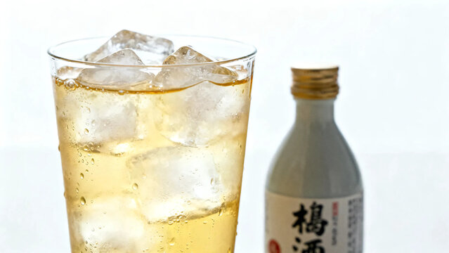 Pouring fresh cold water from a bottle into a glass with ice cubes on white background