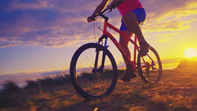 A senior adult enjoys a serene cycling adventure along a lakeside path at sunset, embracing an active lifestyle. The vibrant sky and gentle shadows highlight the peacefulness.