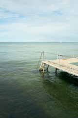 Fototapeta premium Empty wooden jetty on a calm sea