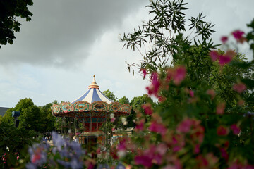 Vintage carousel ride in a park on a cloudy day © Cavan