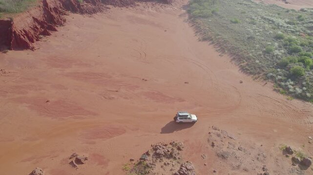 4WD Camped beside Eroded Red Cliff Formations at James Price Point