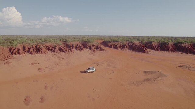 4WD Drive By Eroded Red Pindan Cliffs at James Price Point