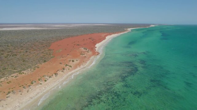 Red Sand Meeting Turquoise Ocean along Remote Coastline of Shark Bay