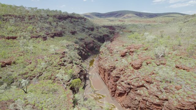 flying over a deep red rock gorge in Western Australia