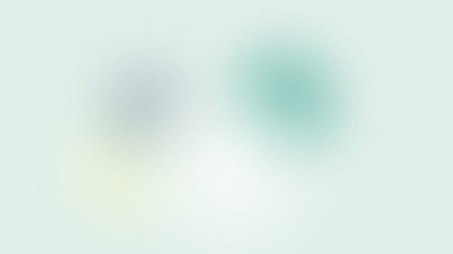 Abstract soft gradient background with glowing pastel blue and green spots on light mint color tone