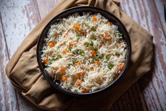 Vegetable pulao or basmati rice made with vegetables served in a bowl. Close up, selective focus