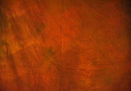 Dark orange studio background. Close up, selective focus. Useful for designing purpose.