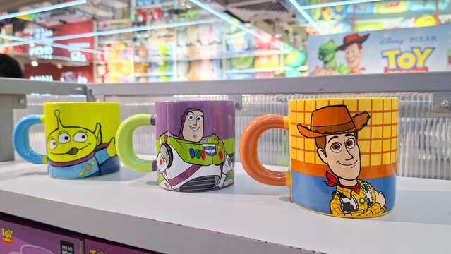 Disney Pixar Toy Story character ceramic mugs featuring Woody Buzz Lightyear and Alien displayed on retail shelf in September 17, 2026 in Bangkok, Thailand.