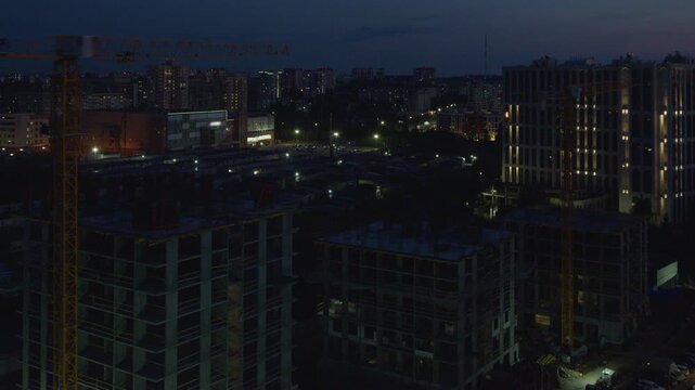 Day to night timelapse of the constriction site of the living building in the city