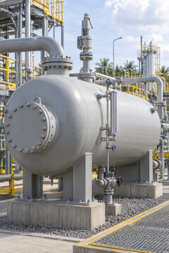 Horizontal three-phase separator pressure vessel installed in a modern industrial process plant