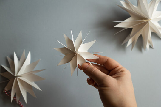 DIY gift handmade Christmas tree decorations: toy snowflakes star. paper craft for kids. create art for children.