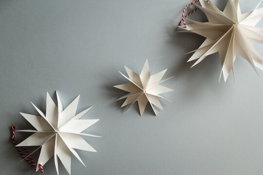 DIY gift handmade Christmas tree decorations: toy snowflakes star. paper craft for kids. create art for children. step by step