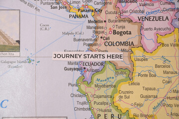 Obraz premium Journey starts here concept tag positioned over Ecuador and South America on a physical continental map