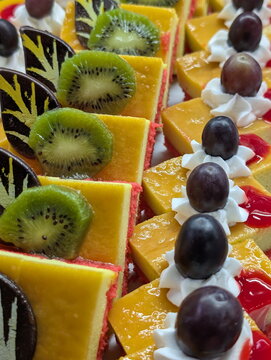 Vibrant Dessert Display: Kiwi, Grapes, Cakes