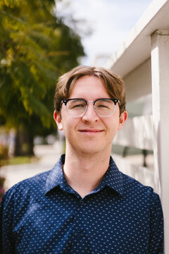 Portrait of a smiling young man outside