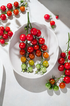 Colorful cherry tomatoes ripening on the vine in a bowl