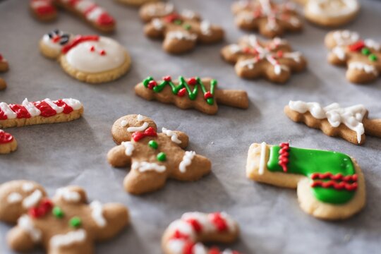 Festive Christmas cookies shaped like trees, stockings, and gingerbread.