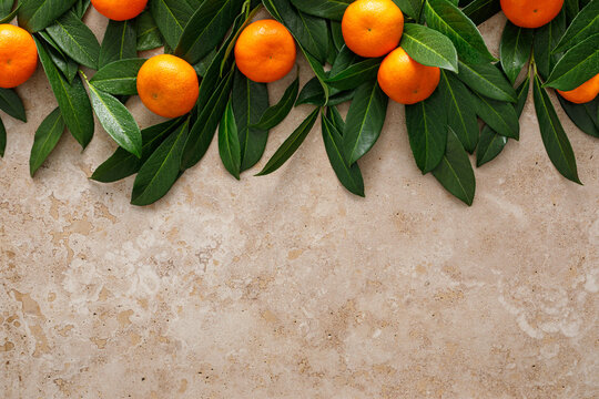 Mandarins fresh citrus fruit with green leaves