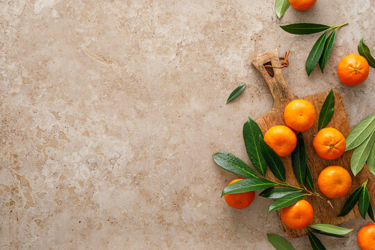 Mandarins fresh citrus fruit with green leaves