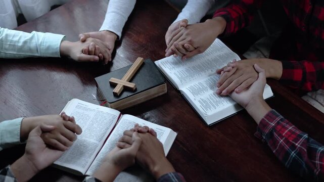 Diverse Teens Praying with Holy Bible Inside Church Sanctuary