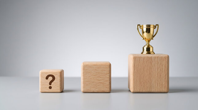 A gold trophy standing on top of a wooden block next to a question mark cube