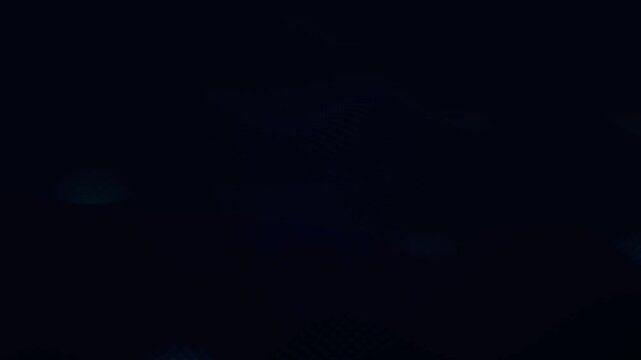 Dark blue abstract motion background loop with subtle digital glowing wave patterns