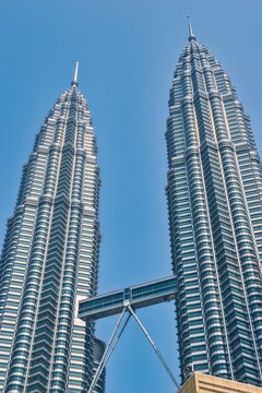 KUALA LUMPUR, MALAYSIA - SEPTEMBERER 14, 2025: Petronas Towers. Petronas Towers, also known as Menara Petronas is the tallest buildings in the world from 1998 to 2004. On a hot day during wet season.