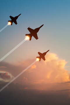 Air Force Day. Aircraft silhouettes on background of sunset. Combat flight of interceptors on a mission. Vertical poster.