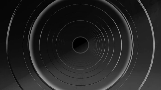 Minimal black silver circular vortex rings deep central opening background suspense, industrial design, futuristic interfaces, music visuals, title sequences, transitions and dramatic presentations