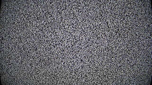 Grainy television static with horizontal interference lines during broadcast interruption