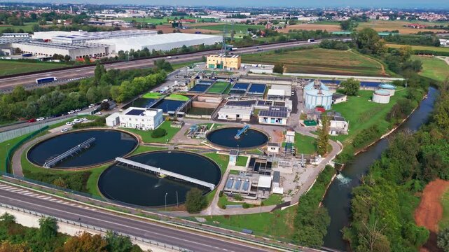 Modern wastewater treatment plant from above. Aerial view of sewage purification tanks for water recycling and sustainable resource management