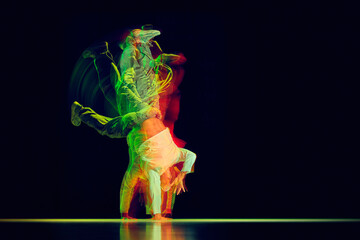 Dynamic dancer holds handstand freeze with colorful motion trails. Concept of dance event posters,...