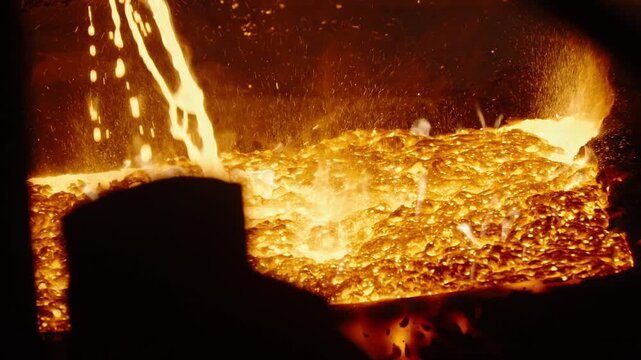 Molten Metal Pouring in Foundry With Fiery Sparks
