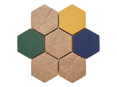 Hexagon cardboard paper texture grid with colorful recycled craft tiles arranged in honeycomb layout isolated on black background for infographic web banner abstract geometry material design concept