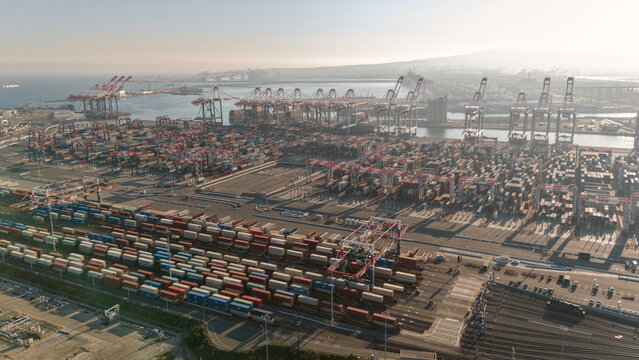 Aerial view of container yard with cranes and cargo terminal