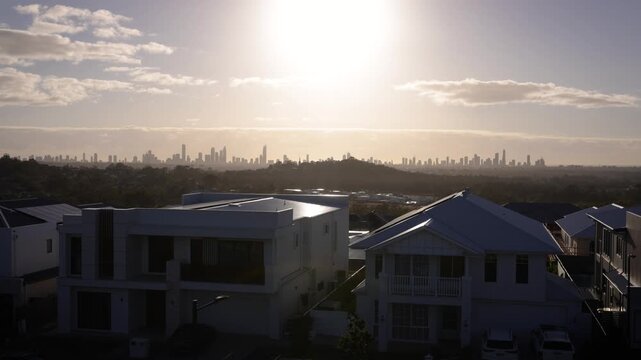 Sunrise view of the SkyRidge development at the base of the Gold Coast hinterland with the Gold Coast skyline in the distance, Queensland, Australia