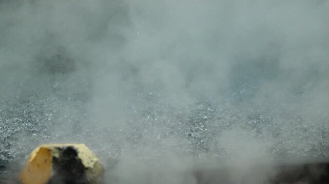 Steam Rising on Wet Asphalt by Yellow Parking Block, Urban B-Roll