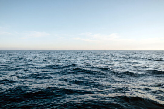 Calm Deep Blue Ocean Water with Horizon Line and Clear Sky Minimal Seascape