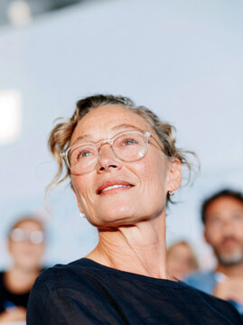 Portrait of Confident Mature Woman with Glasses Looking Up, business setting