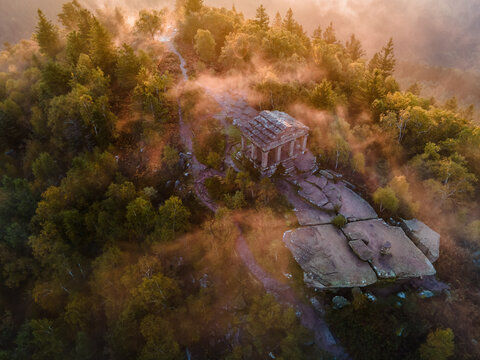 FRANCE ALSACE BAS-RHIN 67 GRANDFONTAINE. PERCHED ATOP THE DONON MASSIF, THE TEMPLE WATCHES OVER THE VOSGES RIDGES, AN ENIGMATIC SILHOUETTE EMERGING FROM A MISTY LANDSCAPE.