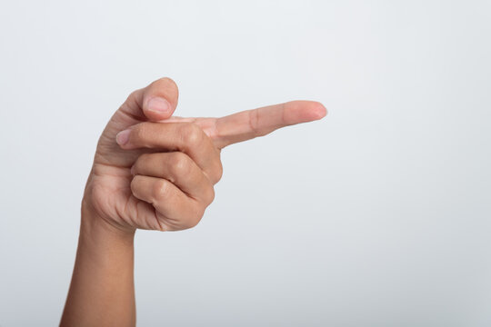 Human hand pointing index finger sideways, showing direction or indicating a choice on a plain white background, presenting information and a clear visual reference for content insertion