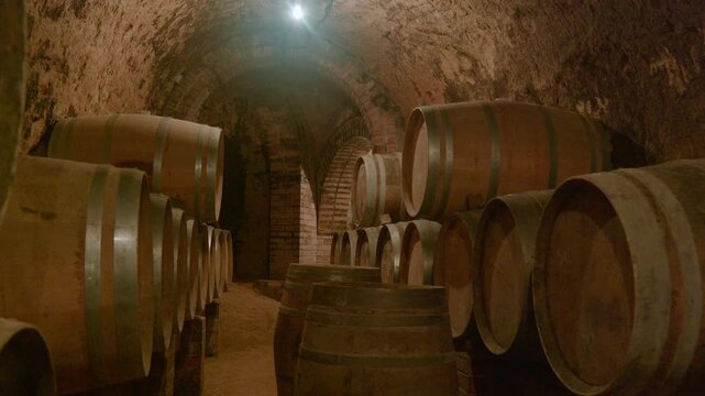 Wine Barrels Stored in Historic Underground Stone Cellar