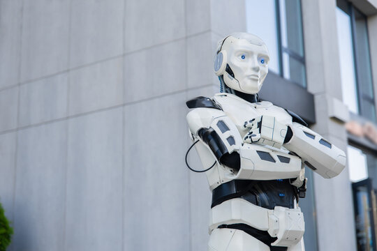 Bionic humanoid standing with crossed arms