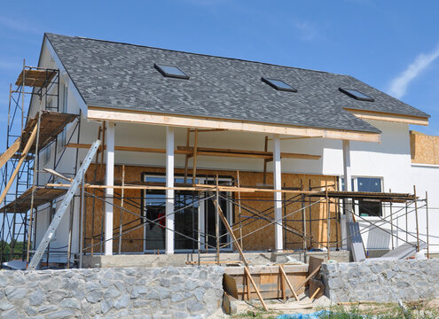 Painting walls, repair attic skylights, patio foundation during house facade renovation