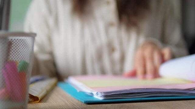 Close Up of Hand Highlighting Document with Green Marker Pen, Studying and Proofreading Concept